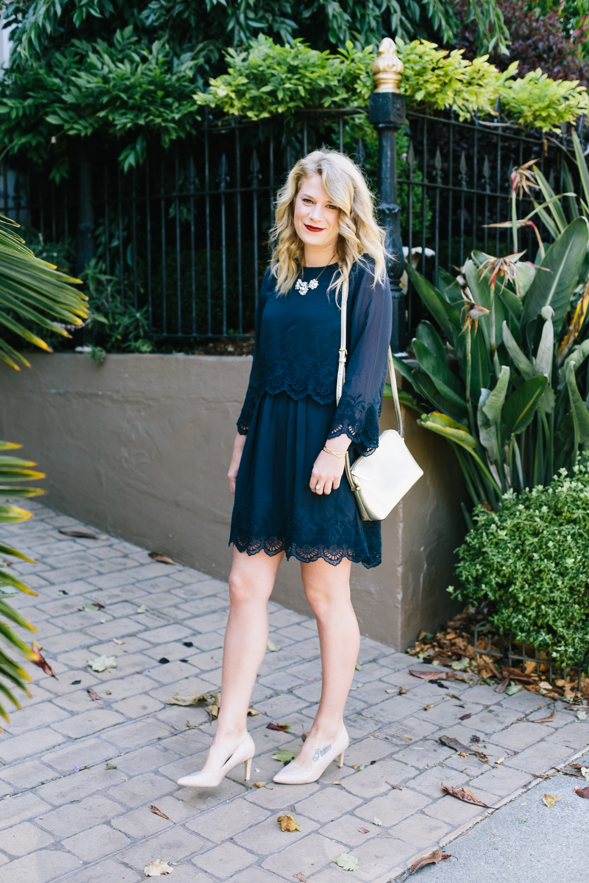 Double Layered Navy Dress from ASOS with Gold Kate Spade Bag.